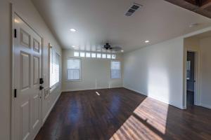 an empty room with white walls and wood floors at Park Street Apartment - Front Unit in Paso Robles