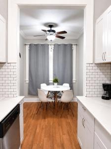 a kitchen with a table and a ceiling fan at Downtown Houston Studio - Walk to Toyota Center in Houston