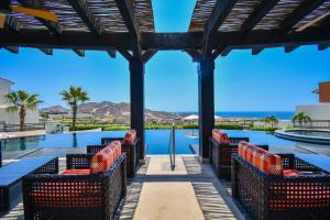 a view of the pool from the patio of a resort at Luxury House with Ocean View in Cabo San Lucas