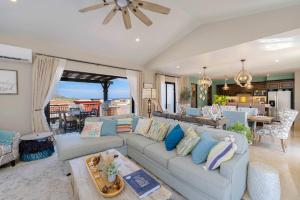 a living room with a couch and a table at Luxury House with Ocean View in Cabo San Lucas