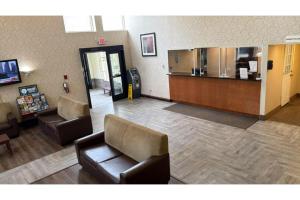 a waiting room with couches and a counter in a hospital at GreenRidge Hotel in Wickliffe