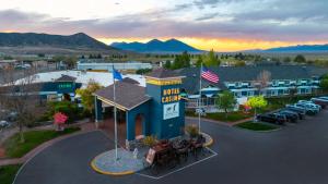 an aerial view of a hotel casino with a parking lot at Prospector Hotel & Gambling Hall in Ely