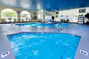 a large indoor pool with blue water in a building at Prospector Hotel & Gambling Hall in Ely