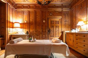 a room with a table in a room with wooden walls at Dimora Perla di Villa - Spacious Wine Estate Retreat near Bernina Express in Villa di Tirano +43 photos