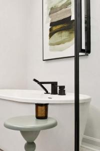 a white table with a sink in a room at Spa - River - Game Room - Le Boreal in Mont-Tremblant +48 photos