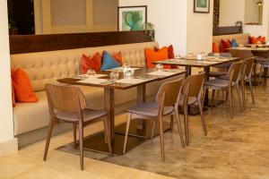 a row of tables and chairs in a restaurant at Lancaster Palace Tamuda Bay in Marina Smir