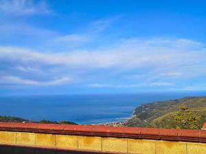 a view of the ocean from the top of a building at Il Ligustro Terrace in Casal Sottano +2 photos