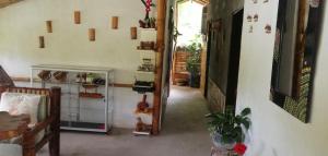 a hallway of a house with a staircase and a room at Hostal El Bambú in Inzá