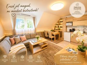 a living room with a couch and a table at Apartman Siesta Bük - Bükfürdő in Bük