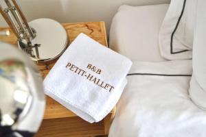 a bed with a white pillow with the word bed psychiatrist at B&B Petit-Hallet in Hannut +40 photos