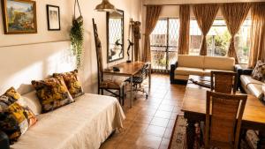 a living room with a couch and a table at Gadute Haven - Luxury Apartment in Pretoria