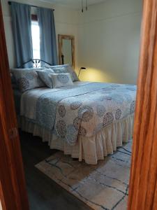a bedroom with a bed and a window at 5 blocks from the hospital! in Bismarck
