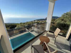 a house with a swimming pool on a balcony at villa efraim read the details from the host for approval in Athens