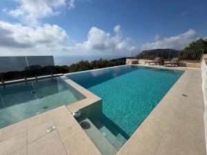 a swimming pool on top of a building at villa efraim read the details from the host for approval in Athens