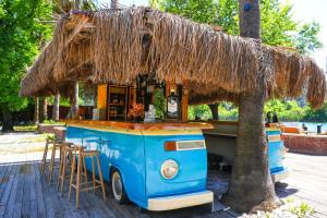 a blue food truck with a straw roof at Dalyan Riverside Private Gaia Koru Bungalows with Swimming Pool Adults Only in Ortaca +24 photos