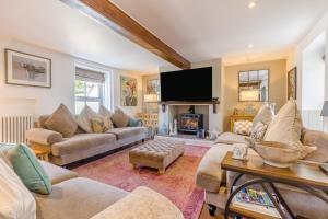 a living room with a couch and a tv at 4 Bed in East Rudham oc-t28312 in East Rudham