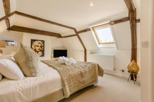 a bedroom with a large white bed and a window at 4 Bed in East Rudham oc-t28312 in East Rudham