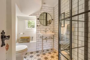 a bathroom with a sink and a toilet at 4 Bed in East Rudham oc-t28312 in East Rudham +25 photos