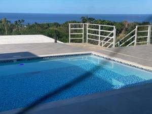 a swimming pool with a view of the ocean at Rico Puerto magic spot east in Cabrera