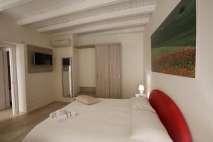 Televízia a/alebo spoločenská miestnosť v ubytovaní B&B Casa Rubis