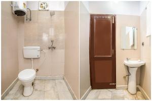 a bathroom with a toilet and a sink at Hotel O krishna in Noida