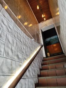 a set of stairs in a building with a stair case at Hotel Cacique in Socorro