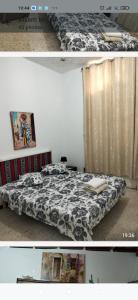 a bedroom with a bed with a black and white comforter at Relax in Tunis