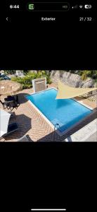 a screenshot of a website with a swimming pool at Rico Puerto Village cabrera in Cabrera