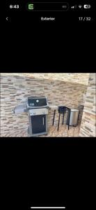 a picture of a grill and a table with a trash can at Rico Puerto Village cabrera in Cabrera