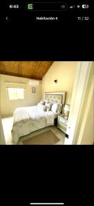 a bedroom with a large bed in a room at Rico Puerto Village cabrera in Cabrera +14 photos