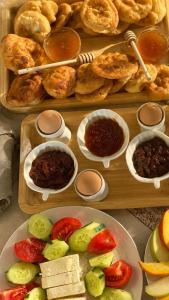 a tray of food with different types of food at Guest House Keli in Nënshat +8 photos