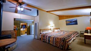 a bedroom with a bed and a ceiling fan at Arrowhead 04 in Red River