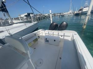 a boat with two chairs on the back of it at 4 Island Boat Tour in Nassau