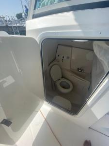 a small toilet in the back of a boat at 4 Island Boat Tour in Nassau