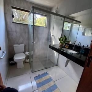 a bathroom with a shower and a toilet and a sink at Pousada Santa Rita in Ouro Preto +13 photos