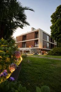 a building with a lawn in front of it at Hotel Jaizkibel in Hondarribia
