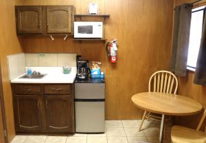 a small kitchen with a sink and a table at Arrowhead 02 in Red River