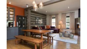 a kitchen and living room with a table and a couch at Bavarian Chalet 1 in Taos Ski Valley
