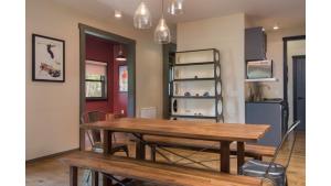 a dining room with a wooden table and chairs at Bavarian Chalet 1 in Taos Ski Valley