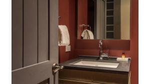 a bathroom with a sink and a mirror at Bavarian Chalet 1 in Taos Ski Valley +13 photos