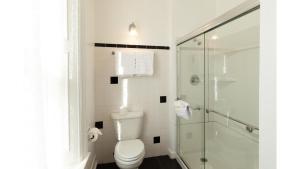 a bathroom with a toilet and a shower at William F. Cody in Cimarron