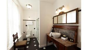 a bathroom with a sink and a toilet at William F. Cody in Cimarron