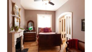 a living room with a dresser and a window at Bat Masterson in Cimarron