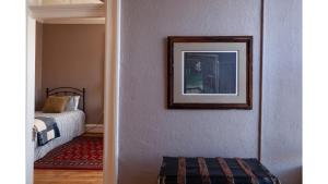 a bedroom with a bed and a picture on a wall at Waite Phillips in Cimarron