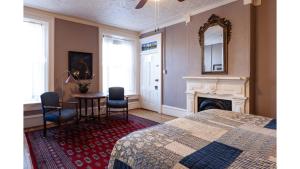 a bedroom with a bed and a table and chairs at Waite Phillips in Cimarron