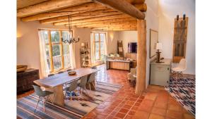 a living room with a wooden table and chairs at Casa Angel in Valdez