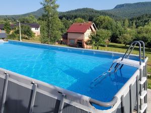 a swimming pool on top of a house at Sunnyside apartments-Pale, Ravna Planina, pool & jacuzzi in Pale