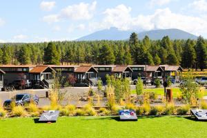 a row of houses in a park with green grass at Village Camp Flagstaff in Bellemont