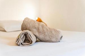 a stuffed animal is sitting on a bed at Le Saphir in Saint-Denis