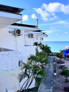 a view of the ocean from the balcony of a building at Hotel Barbasquillo in Manta